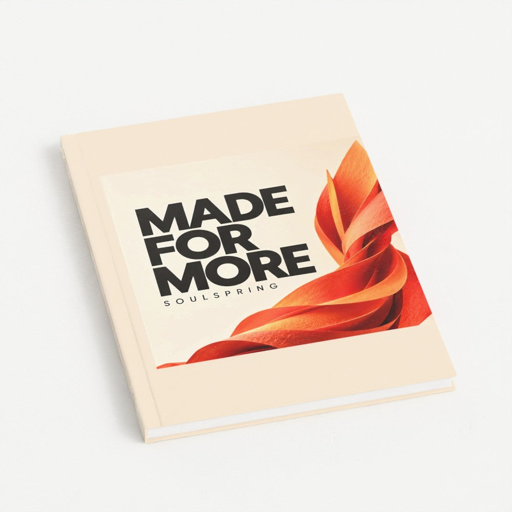 Prodigi mockup of the UK A5 Made for More hardback notebook, with orange artwork on a cream cover