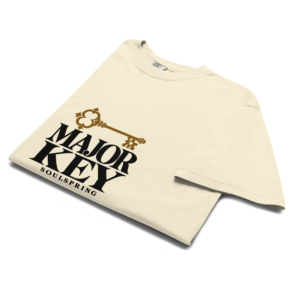 Folded ivory Soulspring Major Key tee showing the print, neckline and fabric